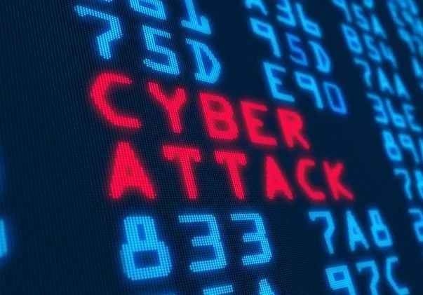 The words "Cyber Attack" in red letters on a coding background.