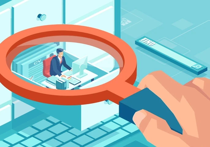 An animated picture of a hand holding a magnifying glass over an employee in a cubicle.