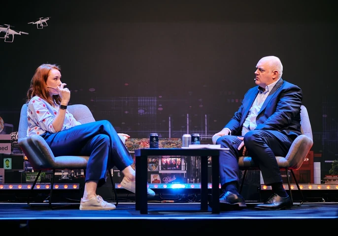 Dara O Briain and Hannah Fry having a discussion on stage at DTX + UCX Europe 2023
