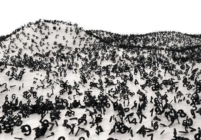 A bunch of black numbers spread out on white dunes.