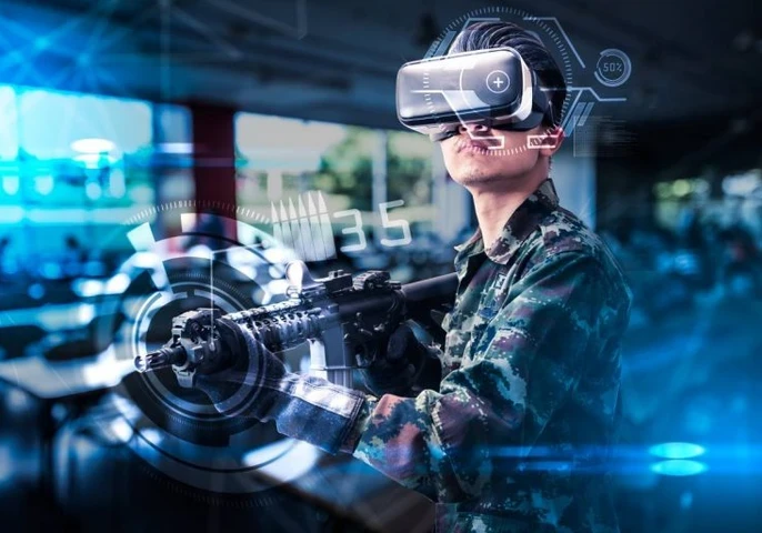 A person holding an imitation gun while using virtual reality goggles.