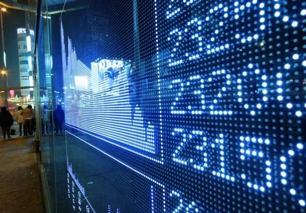 Stock market shown on a digital billboard