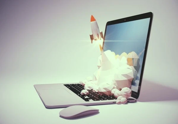drawing of a rocket launching from a laptop