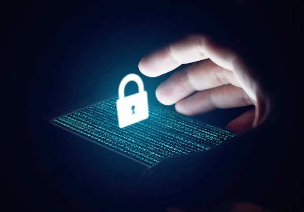 image of a smartphone with code on the screen and a graphic of a padlock floating above