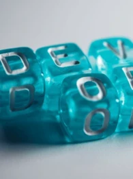 The word "DevOps" on blue blocks.