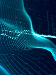 A wave of code and a graph type image on a dark blue background.