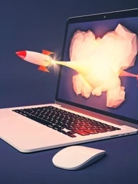 laptop showing a rocket flying out of the screen
