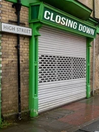 shopfront with a closing down sign