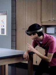 person wearing a VR headset with the virtual elements showing in real life