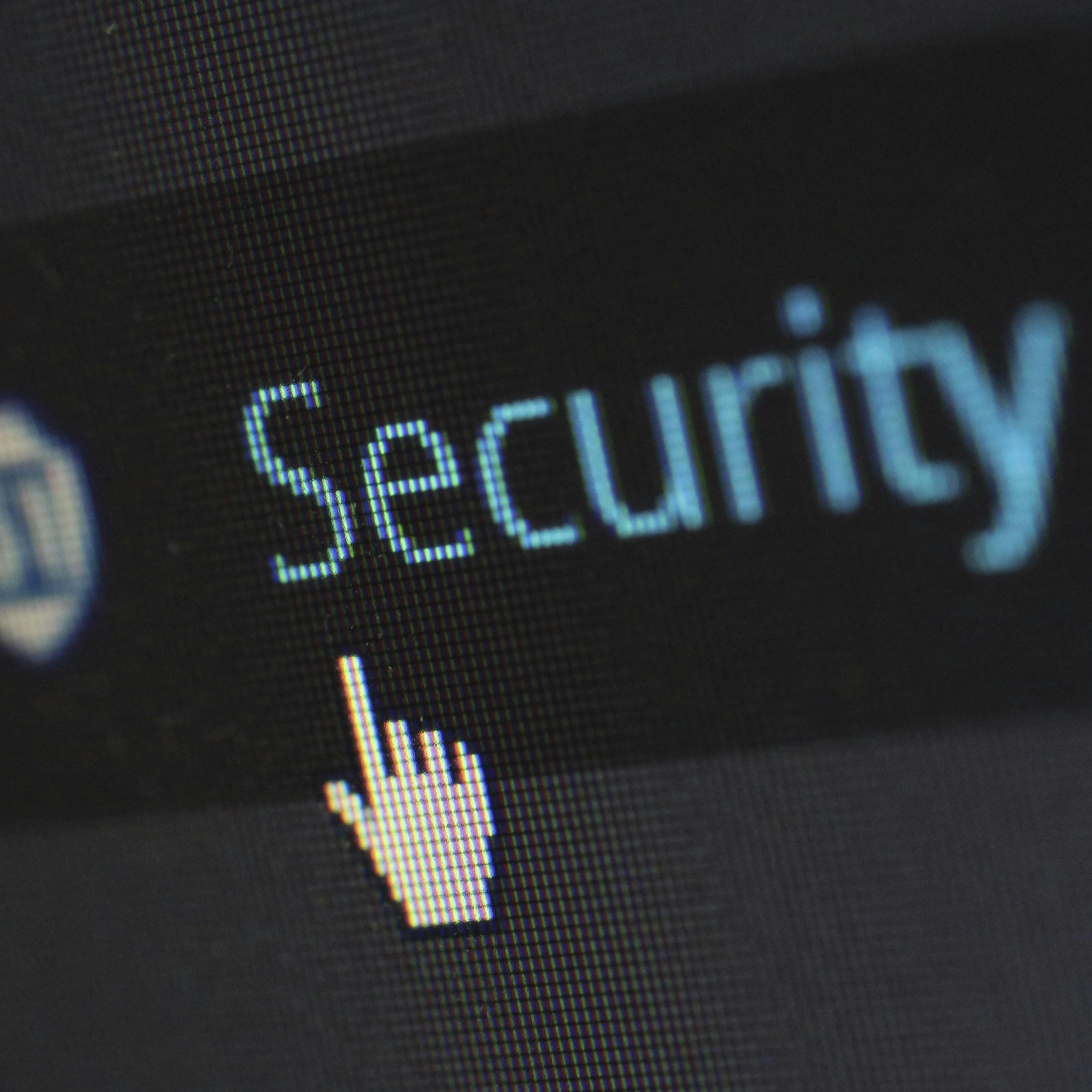 cybersecurity on a screen with mouse icon hovering over 