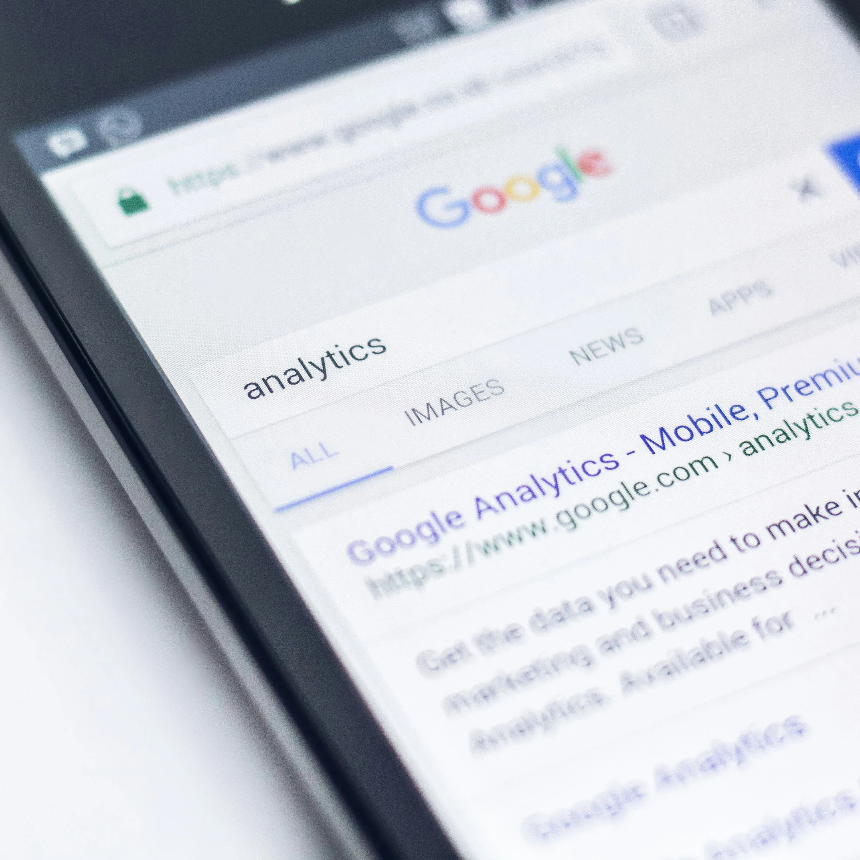 Google search result for "analytics" displayed on a smartphone screen.