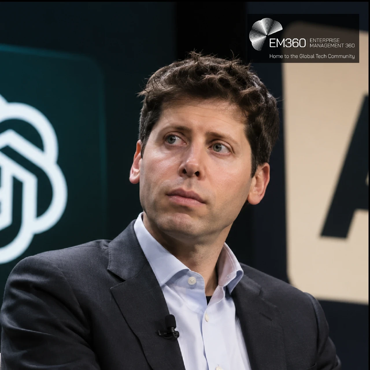 EM360Tech header graphic featuring Sam Altman seated against a dark background, with the OpenAI logo on the left and Anthropic logo on the right. A semi-transparent black banner displays the white text “EM360TECH” and “Sam Altman Says Some AI Harm Is A Price Worth Paying For Broad Access