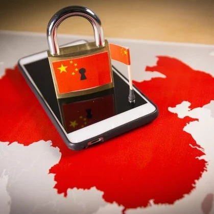 Smartphone on map of China, along with a padlock with the China flag on it