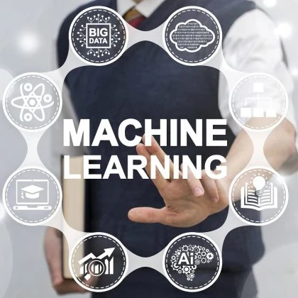 Man standing in front of a graphic depicting machine learning elements.