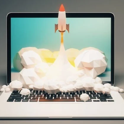 A rocket launching from a laptop